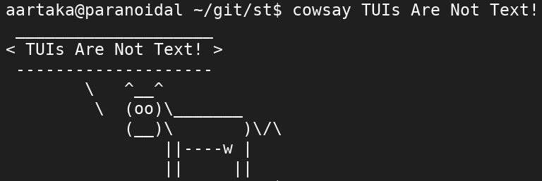 An ASCII drawing of a cow saying 'TUIs Are Not Text!'
